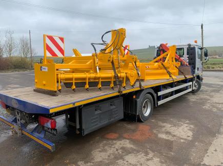 Gravel road grader with rear lights and marker boards