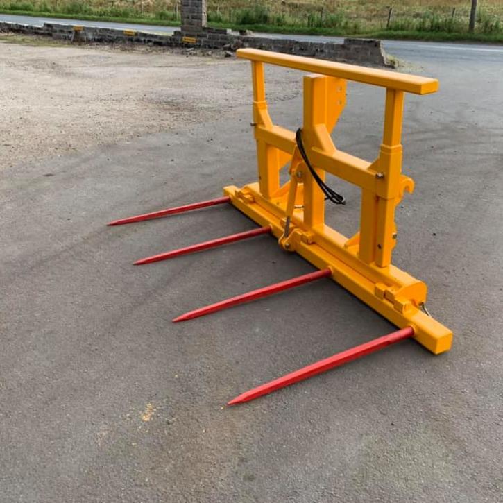 Double folding bale spike with removable goal post