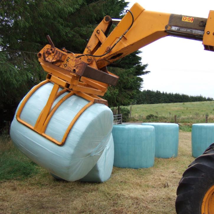 Wrapped Bale Clamp for handing wrapped silage bales.