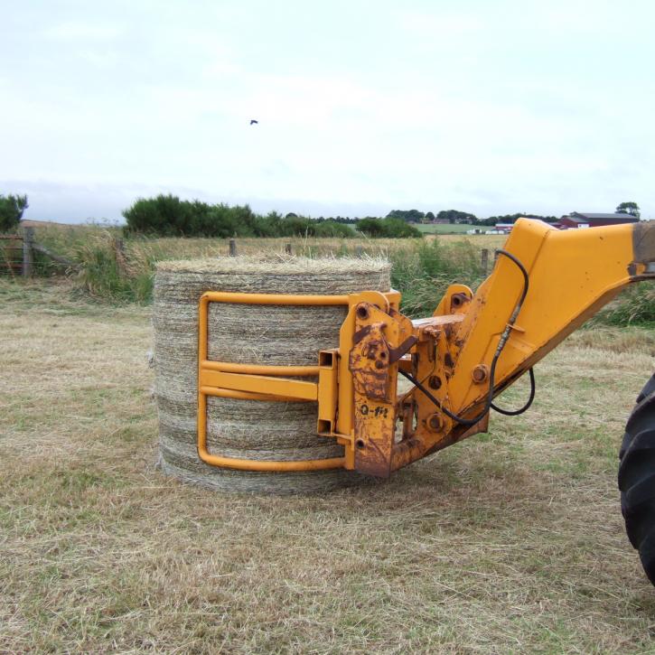 Wrapped Bale Clamp for handing wrapped silage bales.