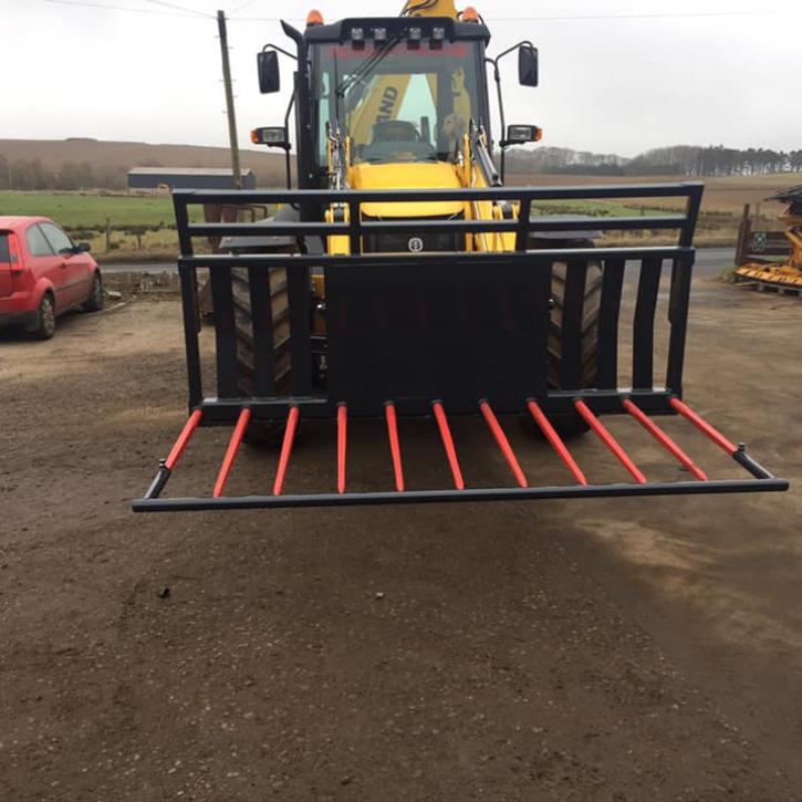 8ft wide Muck Fork with filled in middle, top greedy board and road safe bar