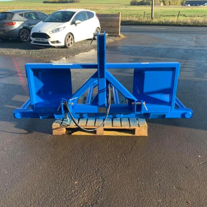 HD double fold up wrapped bale handler finished in New Holland blue