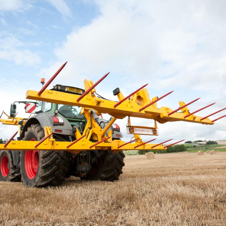 cta-Quad Bale Handling System - front and rear sections for carrying 12 round bales or 6 Heston bales at a time. Showing the hydraulic folding version.