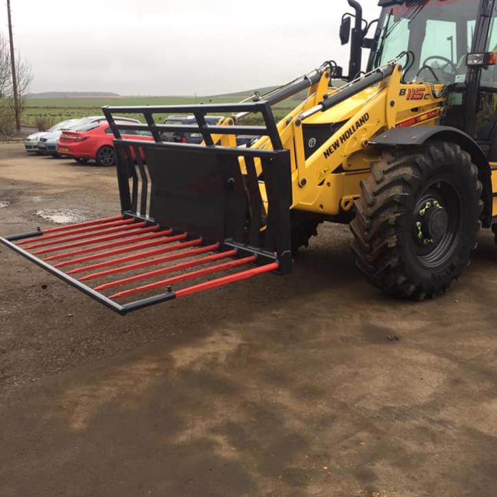 8ft wide Muck Fork with filled in middle, top greedy board and road safe bar