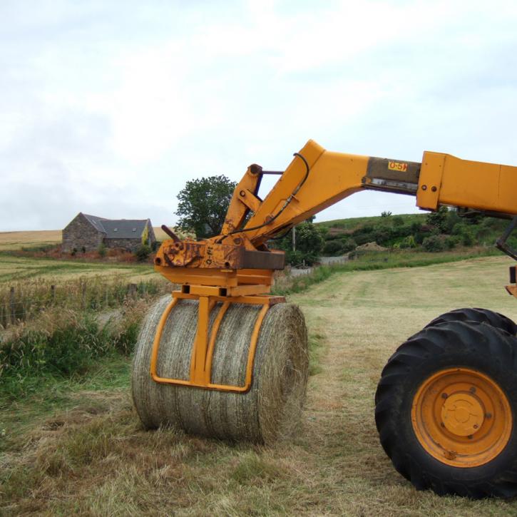 Wrapped Bale Clamp for handing wrapped silage bales.