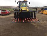 8ft wide Muck Fork with filled in middle, top greedy board and road safe bar