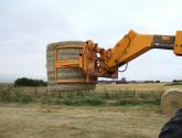 Wrapped Bale Clamp for handing wrapped silage bales.