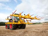 cta-Quad Bale Handling System - front and rear sections for carrying 12 round bales or 6 Heston bales at a time. Showing the hydraulic folding version.