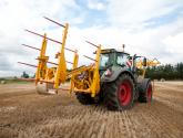 cta-Quad Bale Handling System - front and rear sections for carrying 12 round bales or 6 Heston bales at a time. Showing the hydraulic folding version.