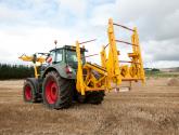 cta-Quad Bale Handling System - front and rear sections for carrying 12 round bales or 6 Heston bales at a time. Showing the hydraulic folding version.