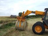 Wrapped Bale Clamp for handing wrapped silage bales.