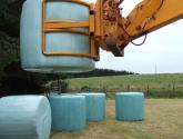 Wrapped Bale Clamp for handing wrapped silage bales.