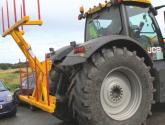Hydraulically folding Big Bale Transporter for the back of tractors.