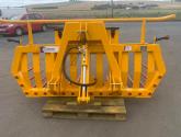 Hydraulic tipping stone fork with tool/weight box